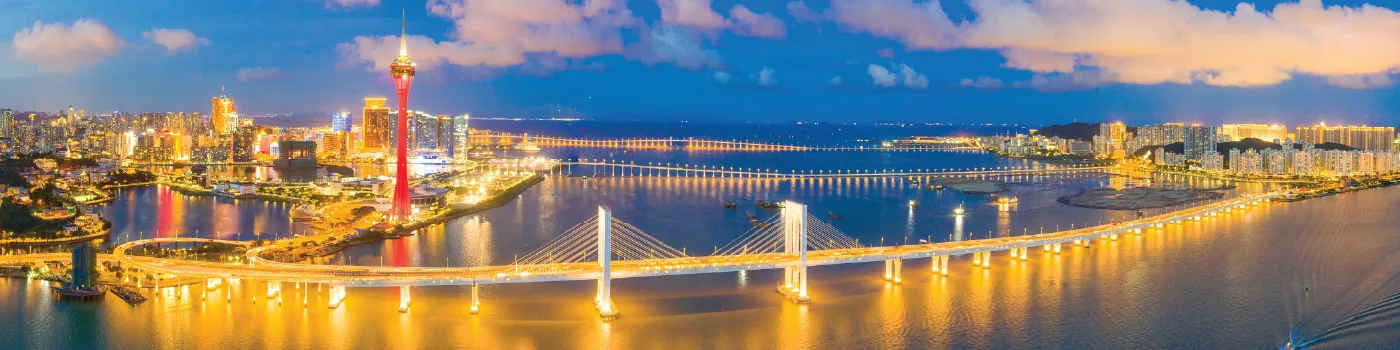 Modern university campus with bridges and evening skyline