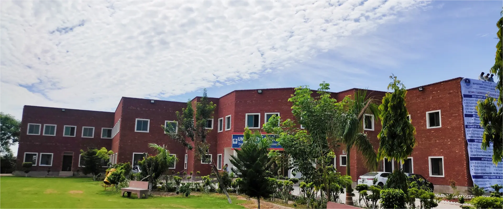 University of Okara campus building illuminated at dusk